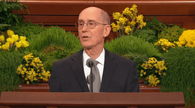 Henry Eyring conduz a 2a sessão da Conferência Geral... de dentro de uma savana?